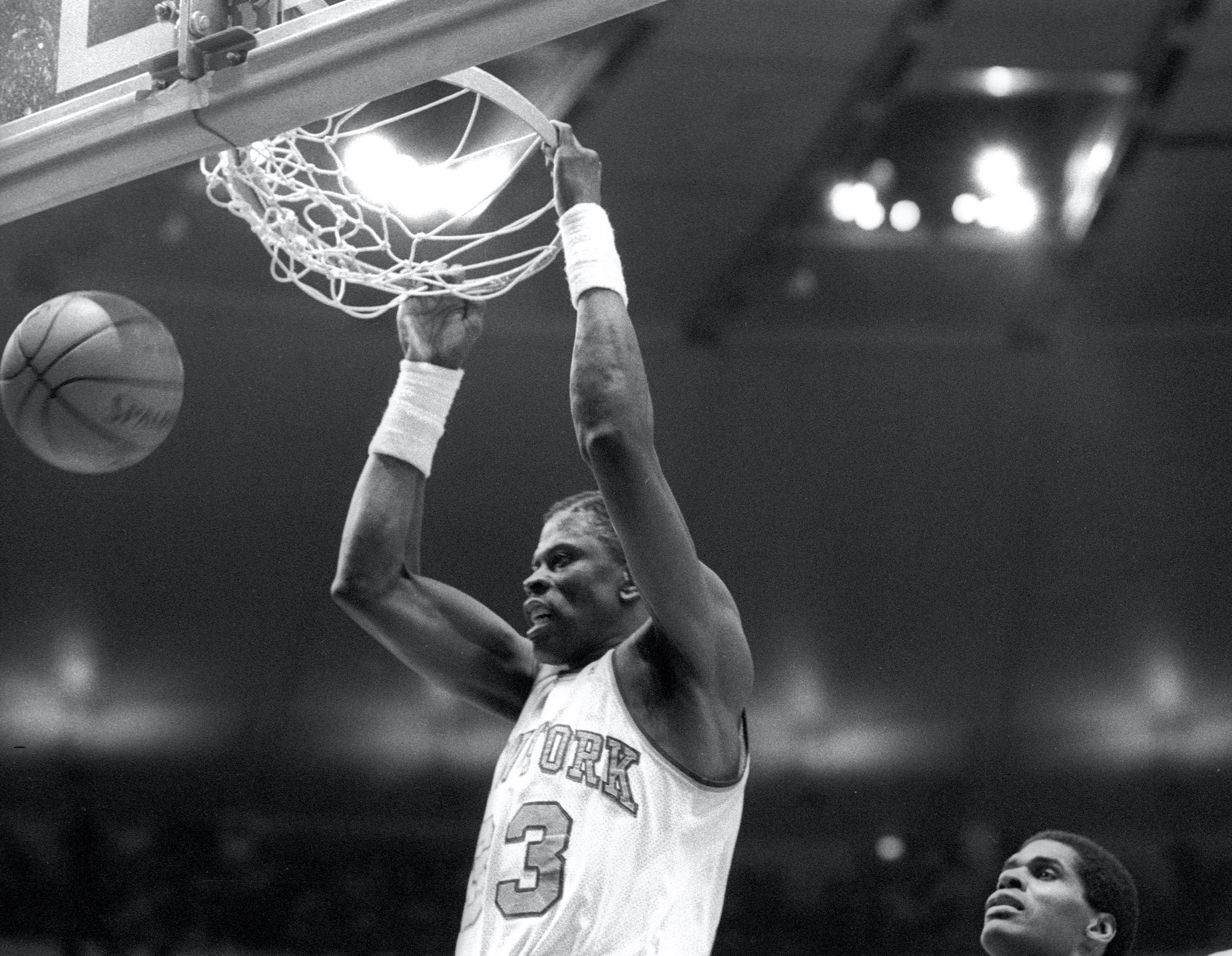 New York Knicks big man Patrick Ewing elevates for a slam dunk.