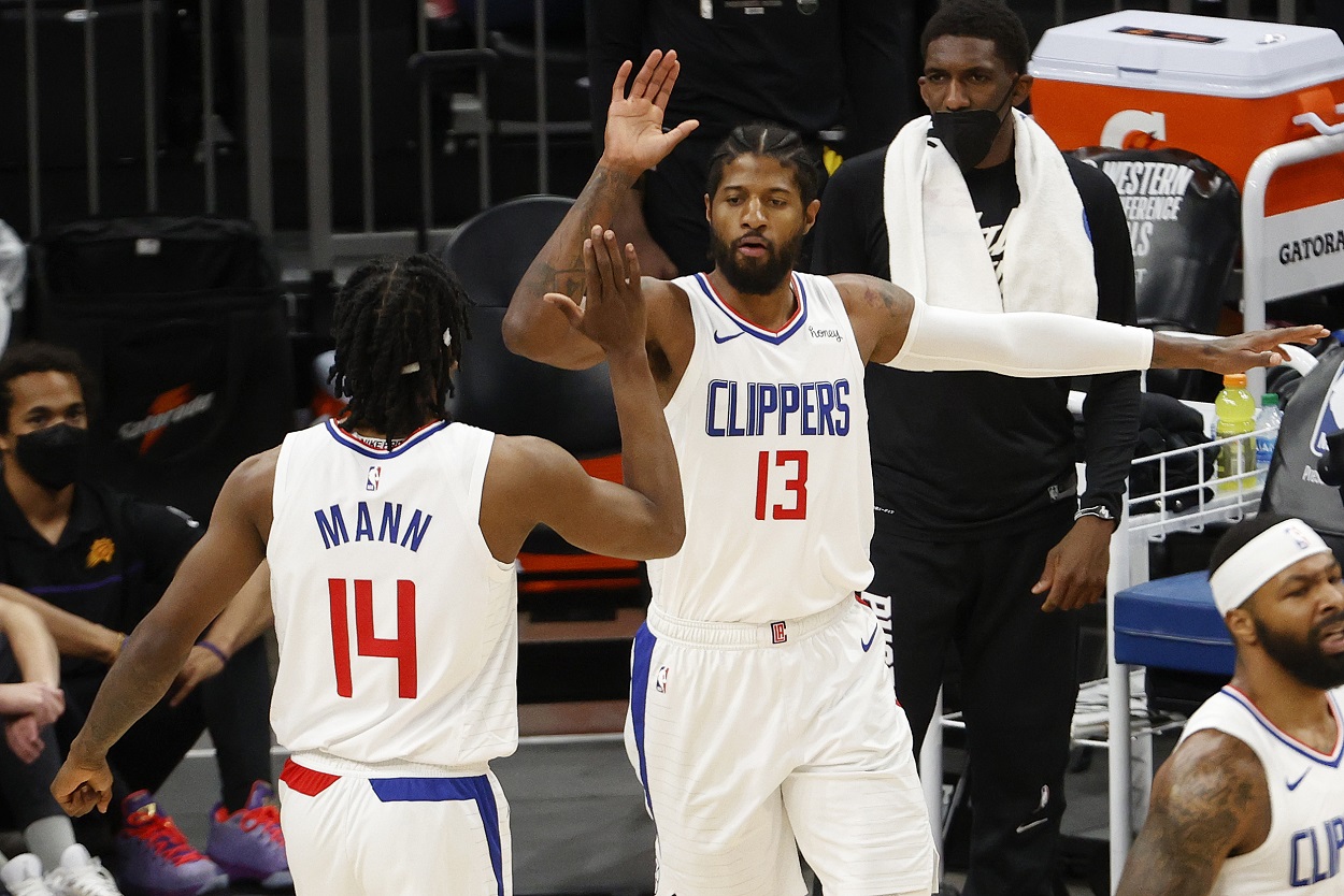 Paul George high-fives Terance Mann during the LA Clippers' Game 5 win over the Phoenix Suns in the 2021 Western Conference Finals