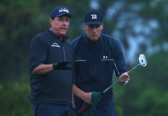 Phil Mickelson reads a putt for NFL quarterback Tom Brady during The Match: Champions For Charity at Medalist Golf Club on May 24, 2020.