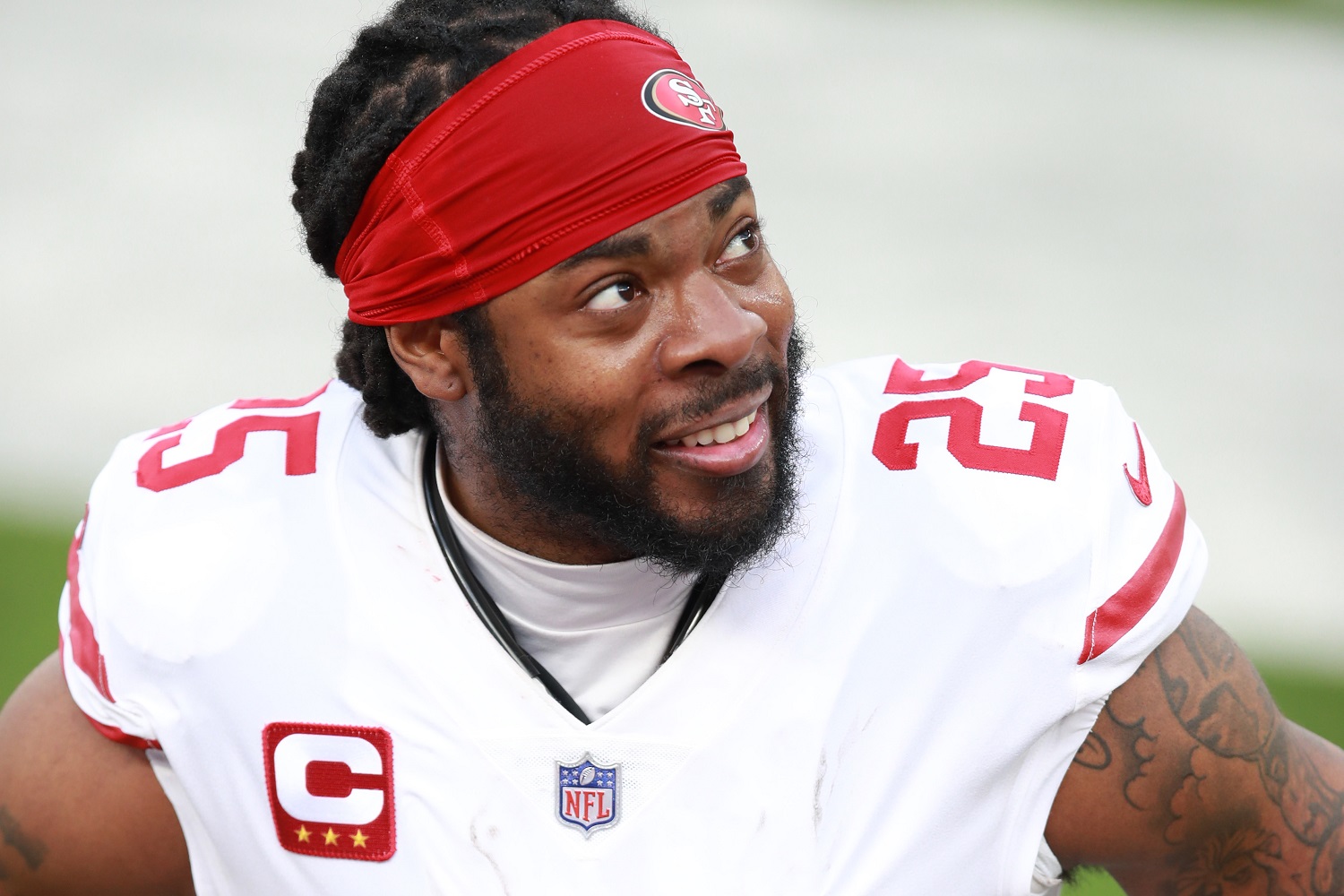 Richard Sherman of the San Francisco 49ers speaks to a teammate on the bench in the second quarter against the Los Angeles Rams at SoFi Stadium on Nov. 29, 2020.