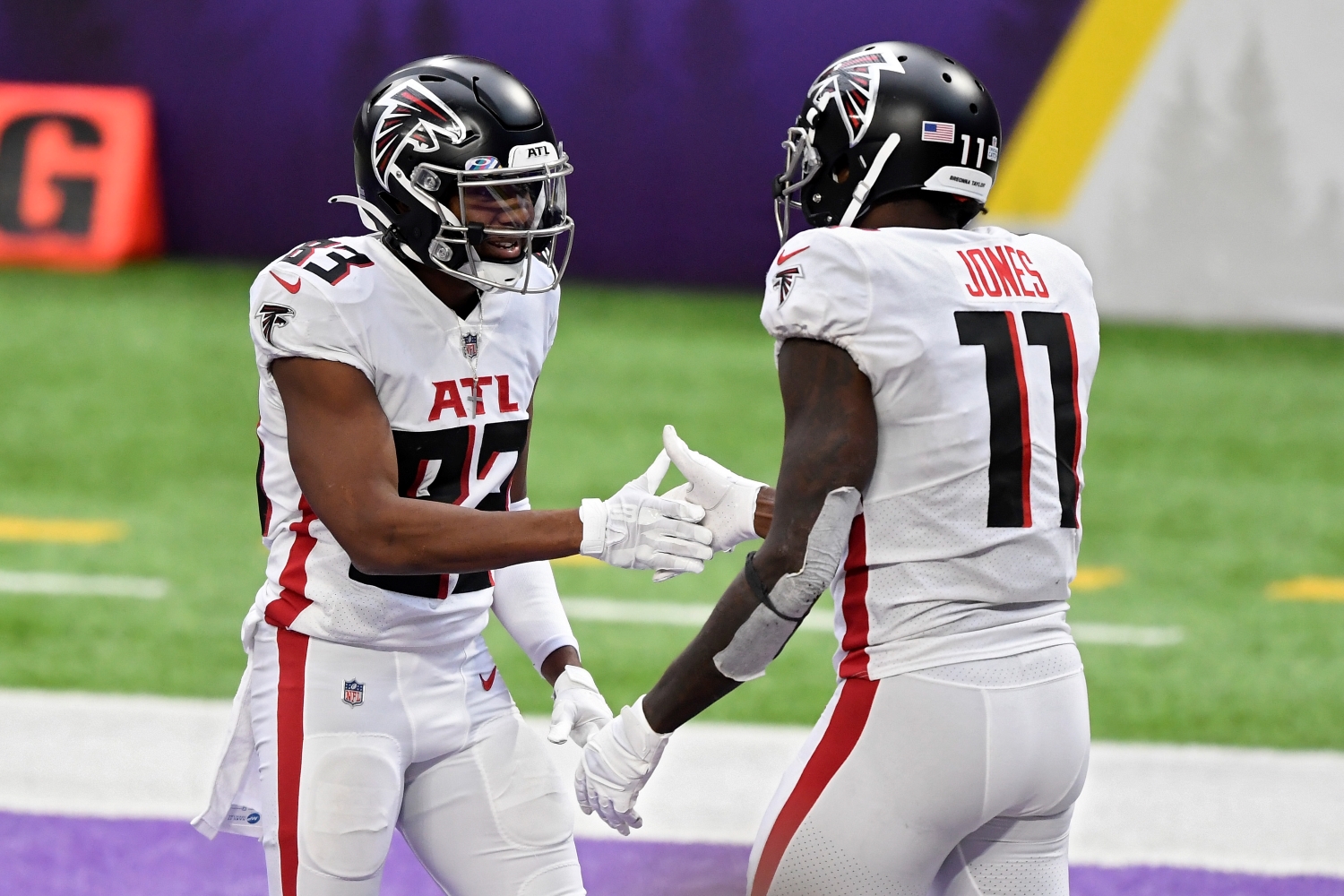 Atlanta Falcons receivers Russell Gage and Julio Jones shake hands in the end zone.