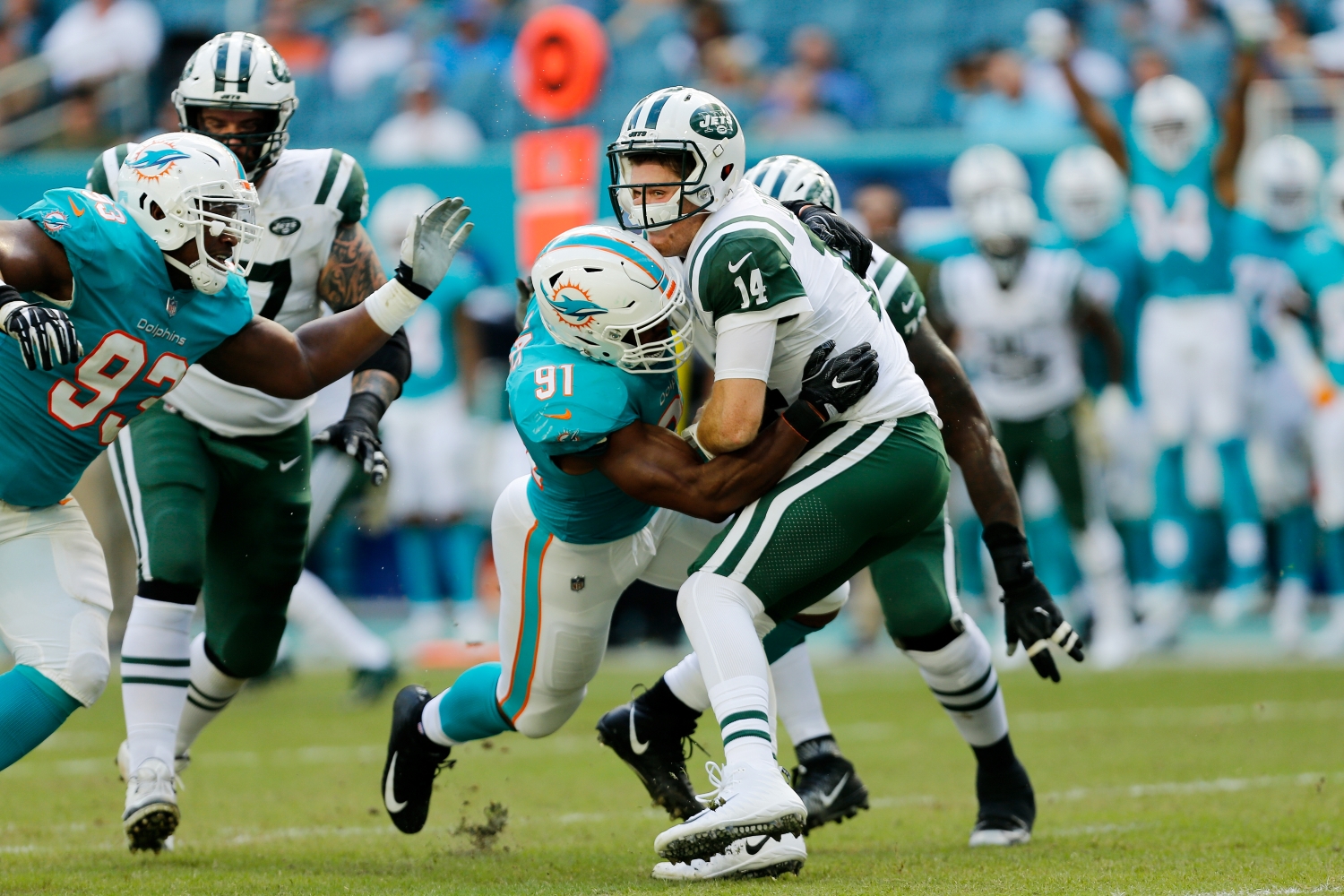 Miami Dolphins defensive end Cameron Wake sacks New York Jets quarterback Sam Darnold.