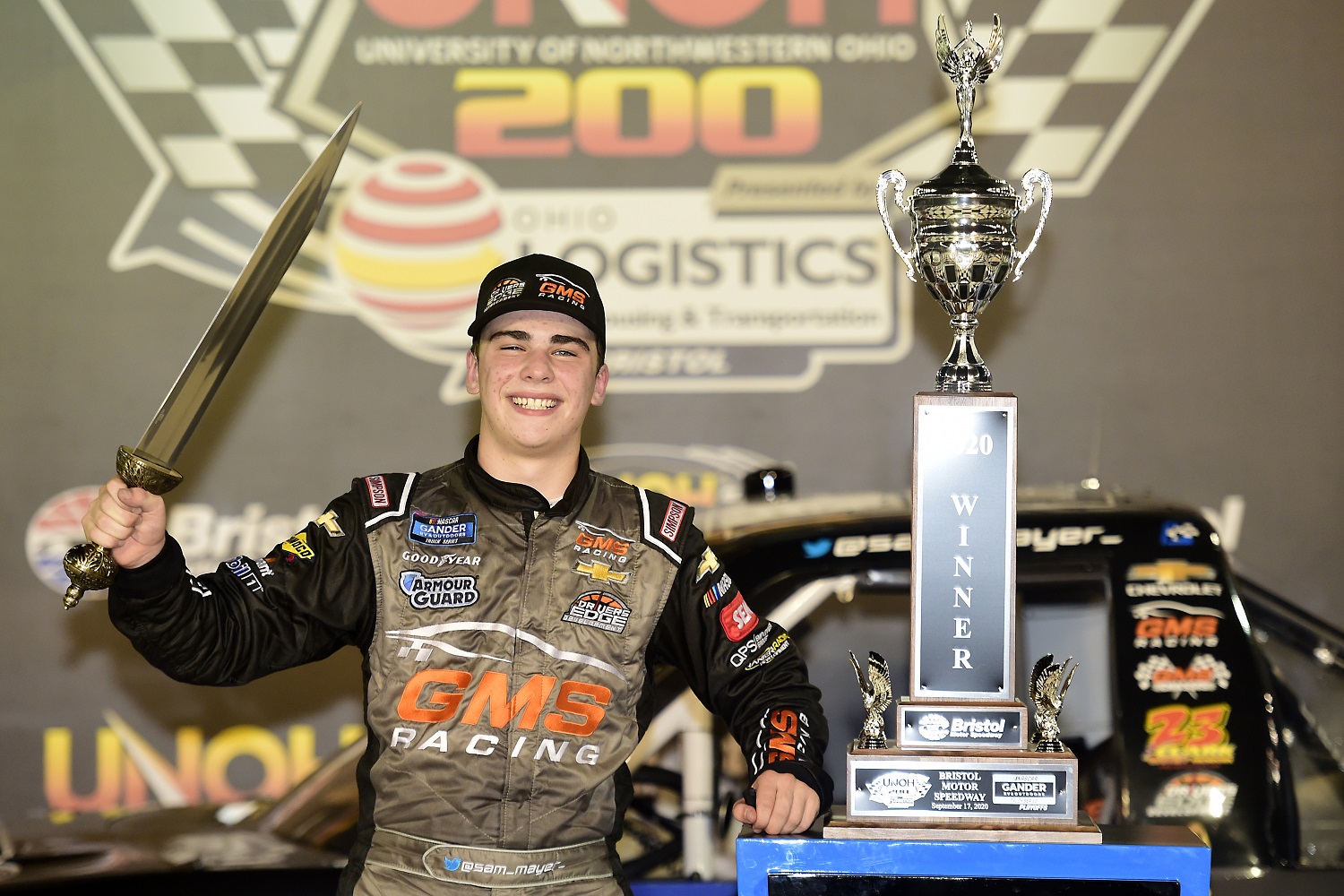 Sam Mayer celebrates in after winning the NASCAR Gander RV & Outdoors Truck Series UNOH 200 at Bristol Motor Speedway on Sept. 17, 2020.