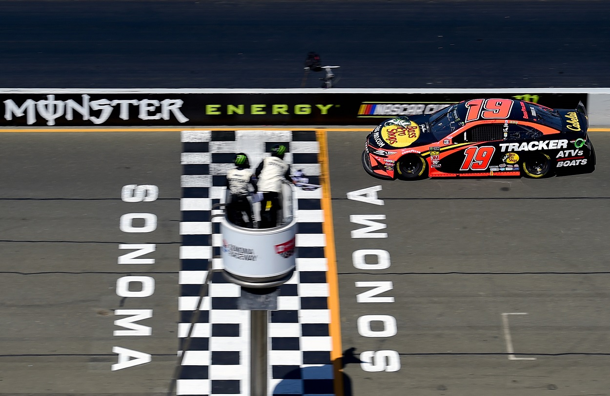 Martin Truex Jr. crosses the finish at Sonoma Raceway to win the 2019 NASCAR Cup Series Toyota/Save Mart 350