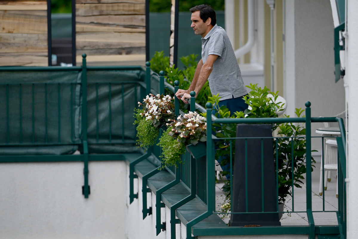 International tennis star Roger Federer watches a match in 2021