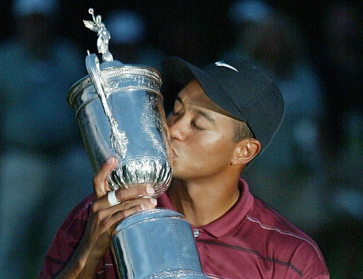 Tiger Woods kisses the U.S. Open trophy following his victory at Bethpage Black in 2002