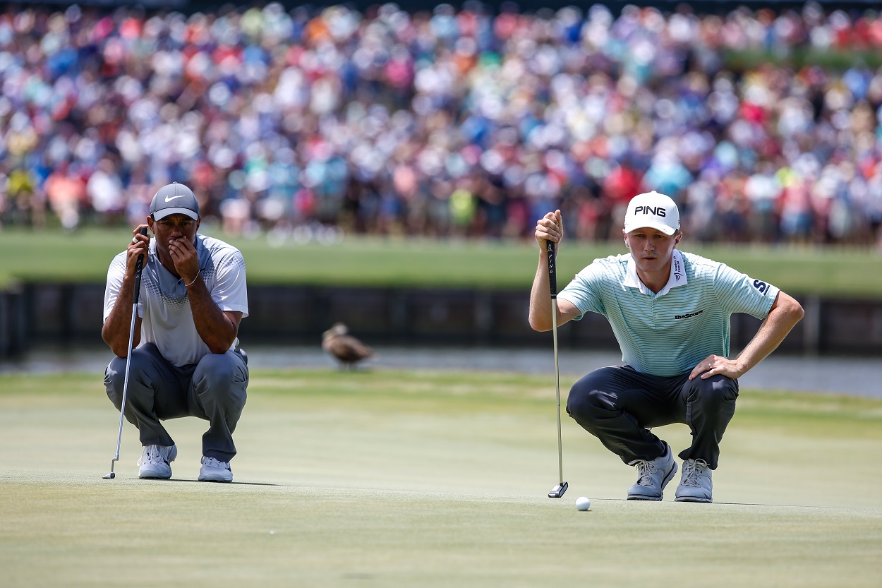 Tiger Woods and Mackenzie Hughes during the third round of The Players Championship in 2018