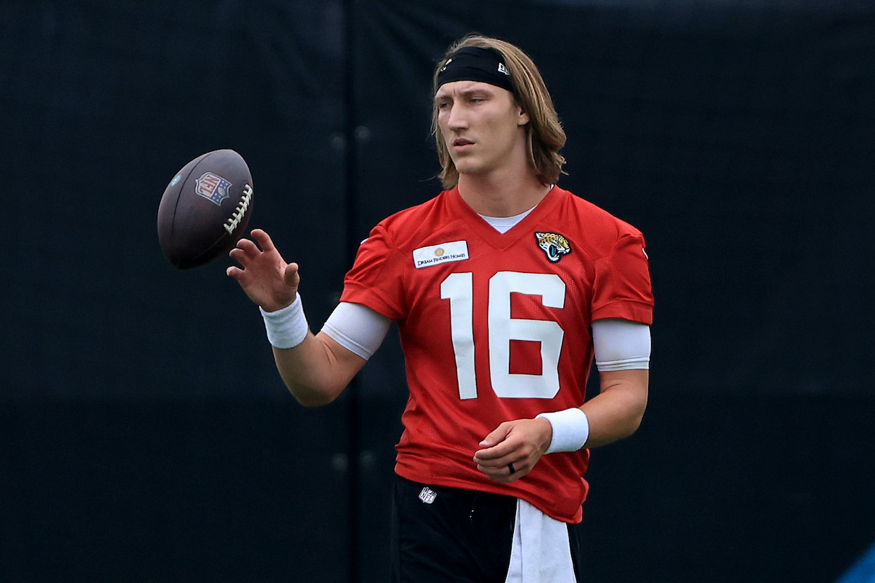 The Jacksonville Jaguars recently gave a Trevor Lawrence injury update saying they're "being cautious" with his hamstring injury. The rookie QB is seen here flipping a ball during minicamp.