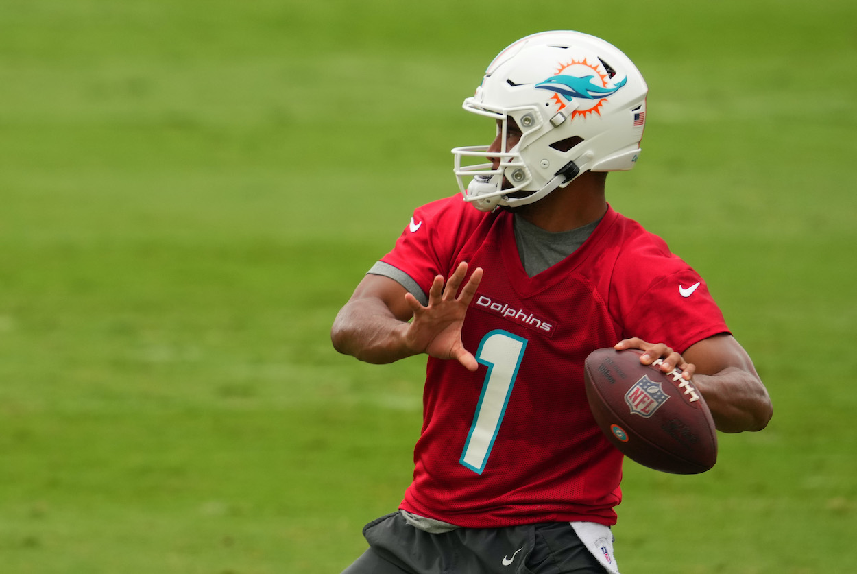 Quarterback Tua Tagovailoa of the Miami Dolphins throws a pass in practice drills during Mandatory Minicamp