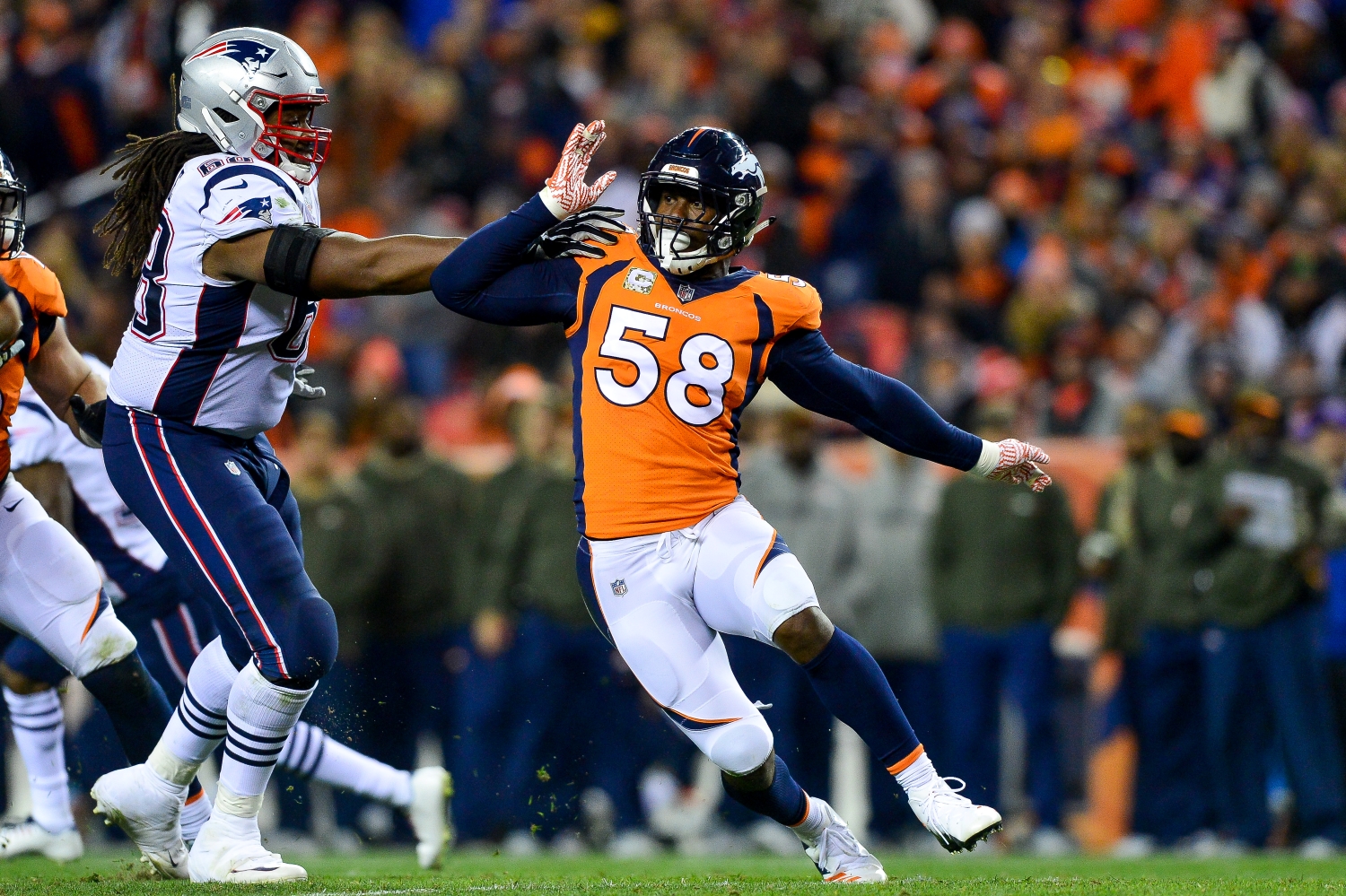 Broncos linebacker Von Miller works around a block attempt by Patriots right tackle LaAdrian Waddle.