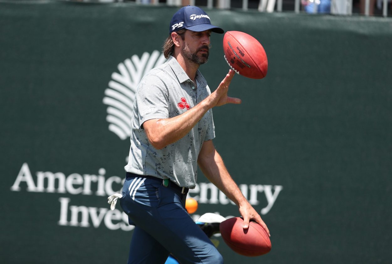 Green Bay Packers quarterback Aaron Rodgers tosses a football during the American Century Championship