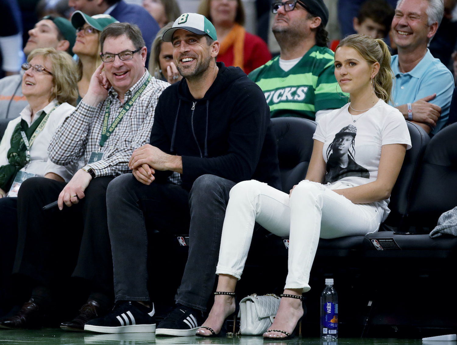 Green Bay Packers quarterback and Milwaukee Bucks owner Aaron Rodgers watches an NBA game from the sideines.