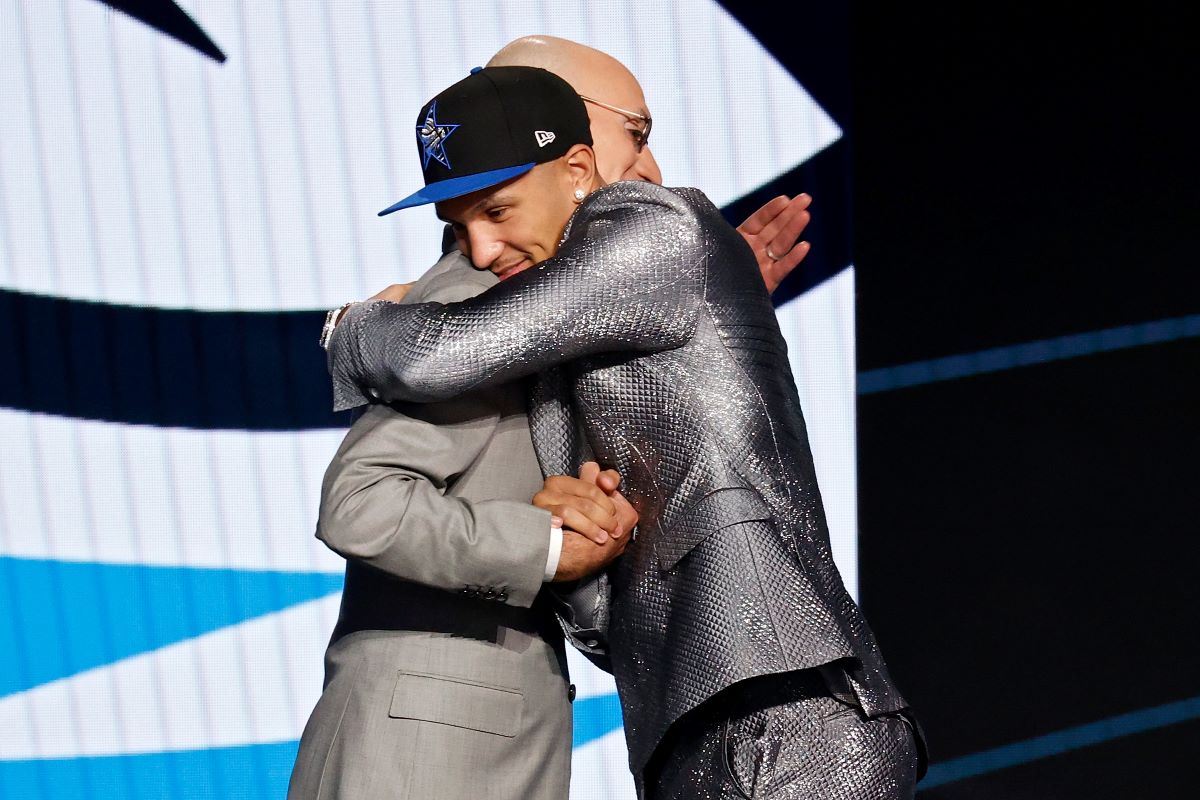 NBA Commissioner Adam Silver hugs Jalen Suggs after his selection by the Orlando Magic during the 2021 NBA Draft.