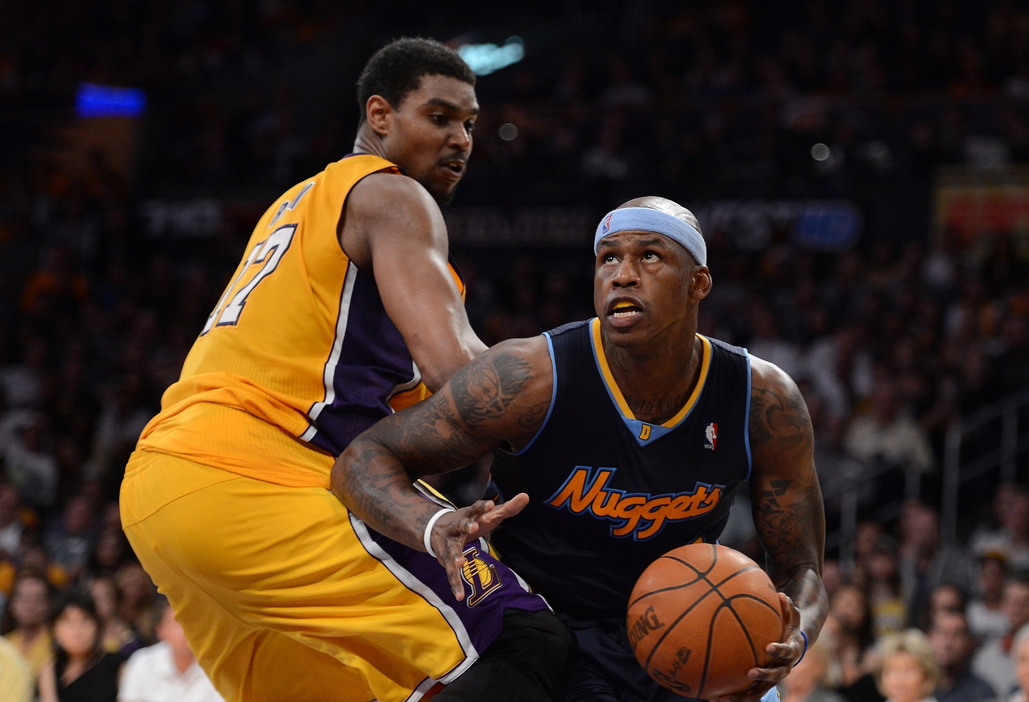 Al Harrington of the Denver Nuggets drives on Andrew Bynum of the Los Angeles Lakers during the 2012 NBA Western Conference quarterfinals.