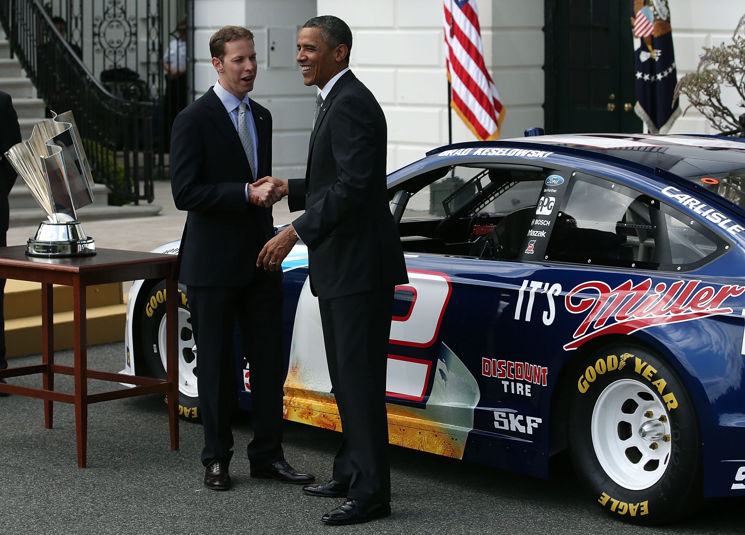 President Barack Obama (R) talks with Sprint Cup Champion Brad Keselowski in 2013.