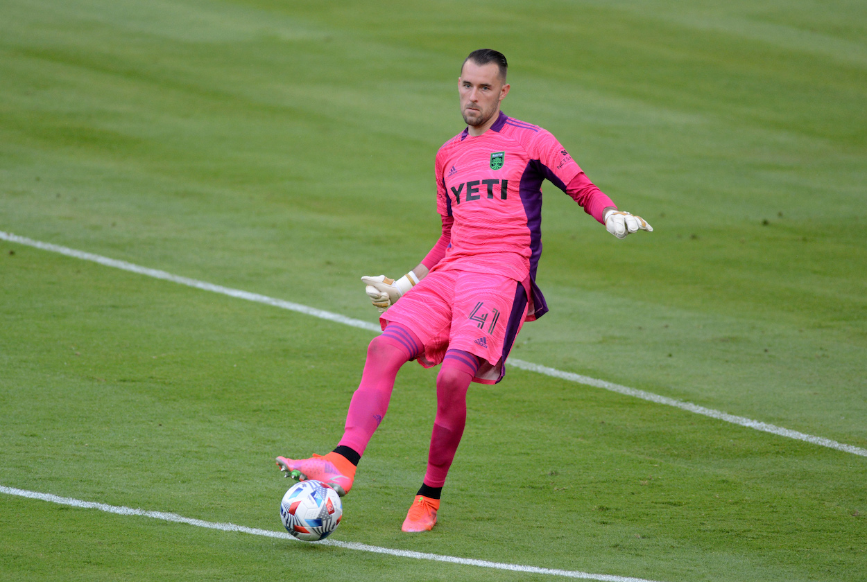 Austin FC Goalkeeper Brad Stuver passes ball