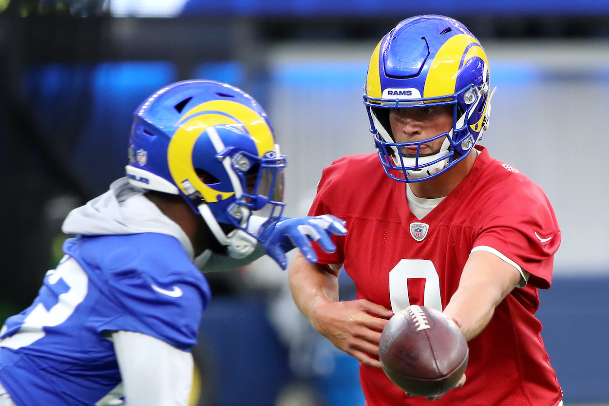 Matthew Stafford of the Los Angeles Rams hands the ball off to Cam Akers during open practice at SoFi Stadium on June 10, 2021 in Inglewood, California.