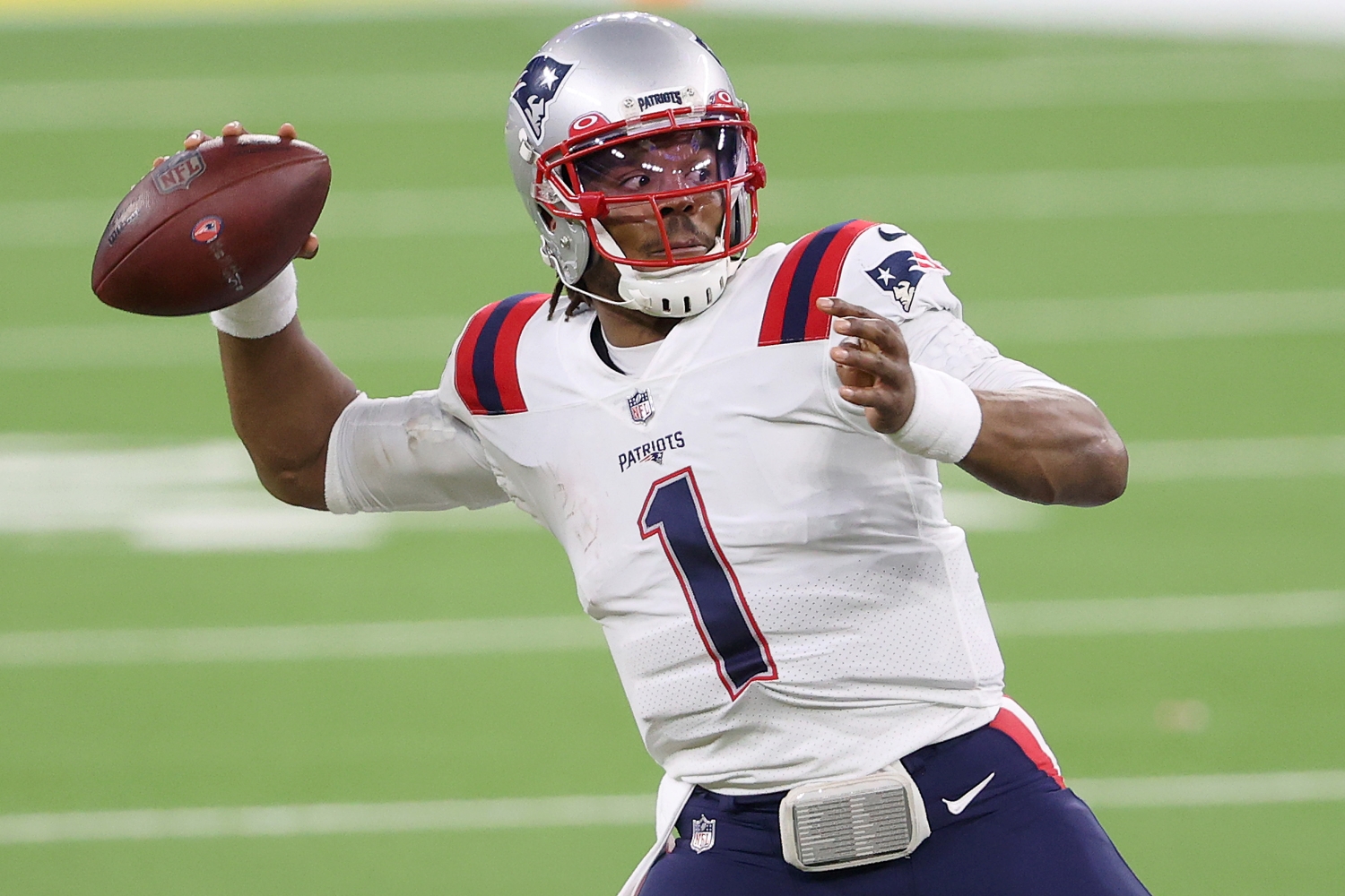 New England Patriots quarterback Cam Newton gets ready to throw a pass.