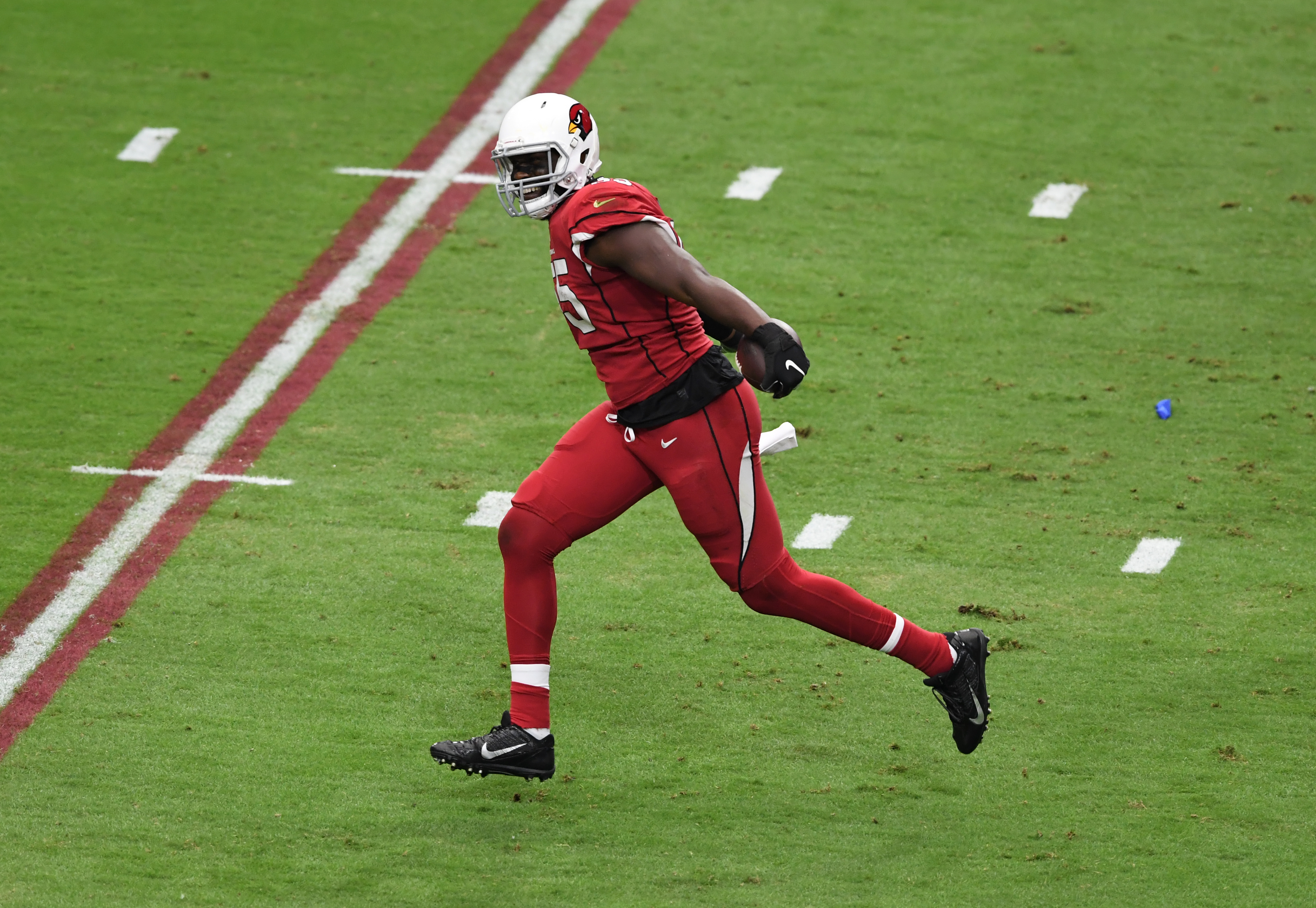 Arizona Cardinals star Chandler Jones celebrates a fumble recovery during a game in September.