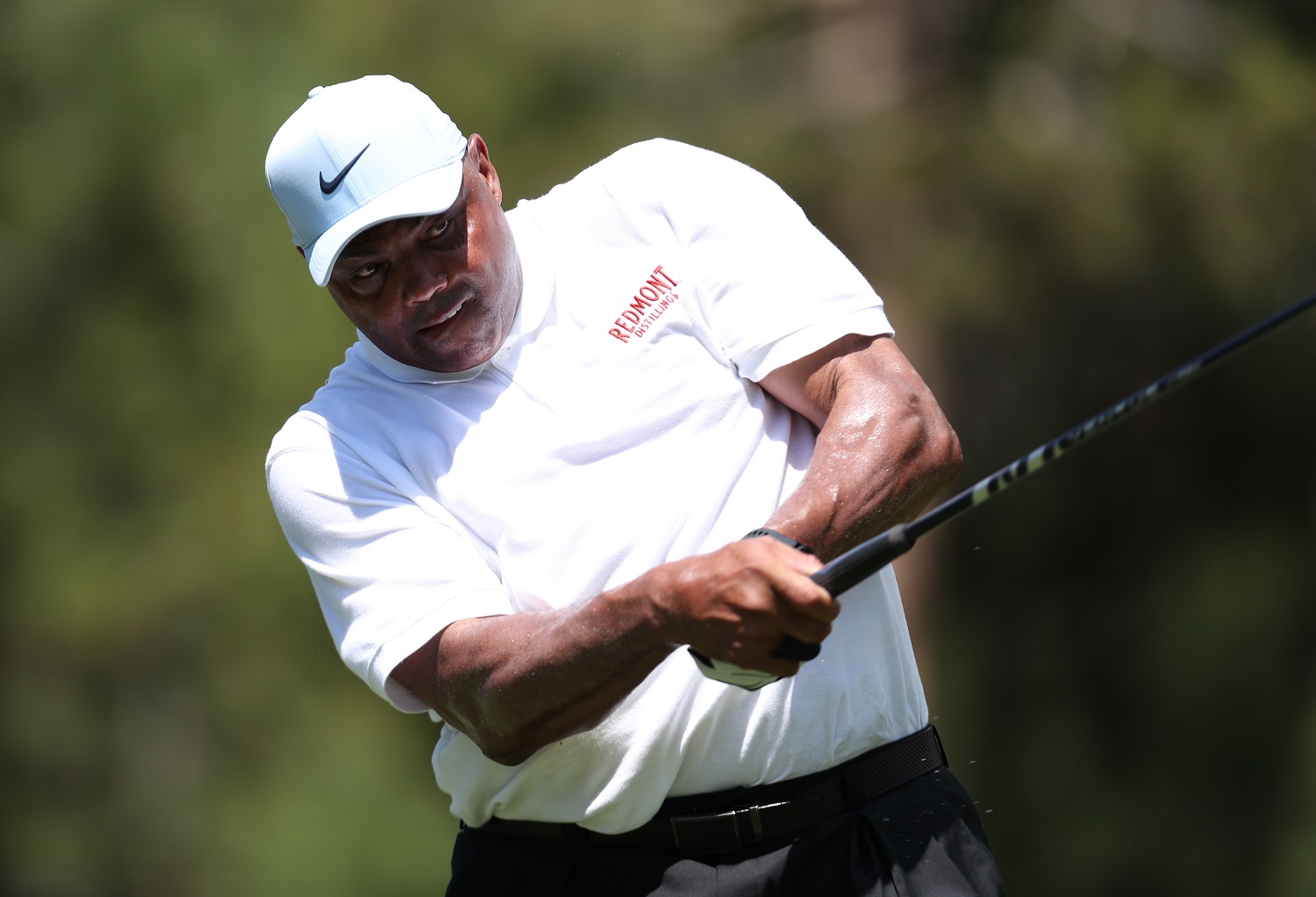 NBA analyst Charles Barkley tees off during the opening round of the American Century Championship at Edgewood Tahoe South golf course.