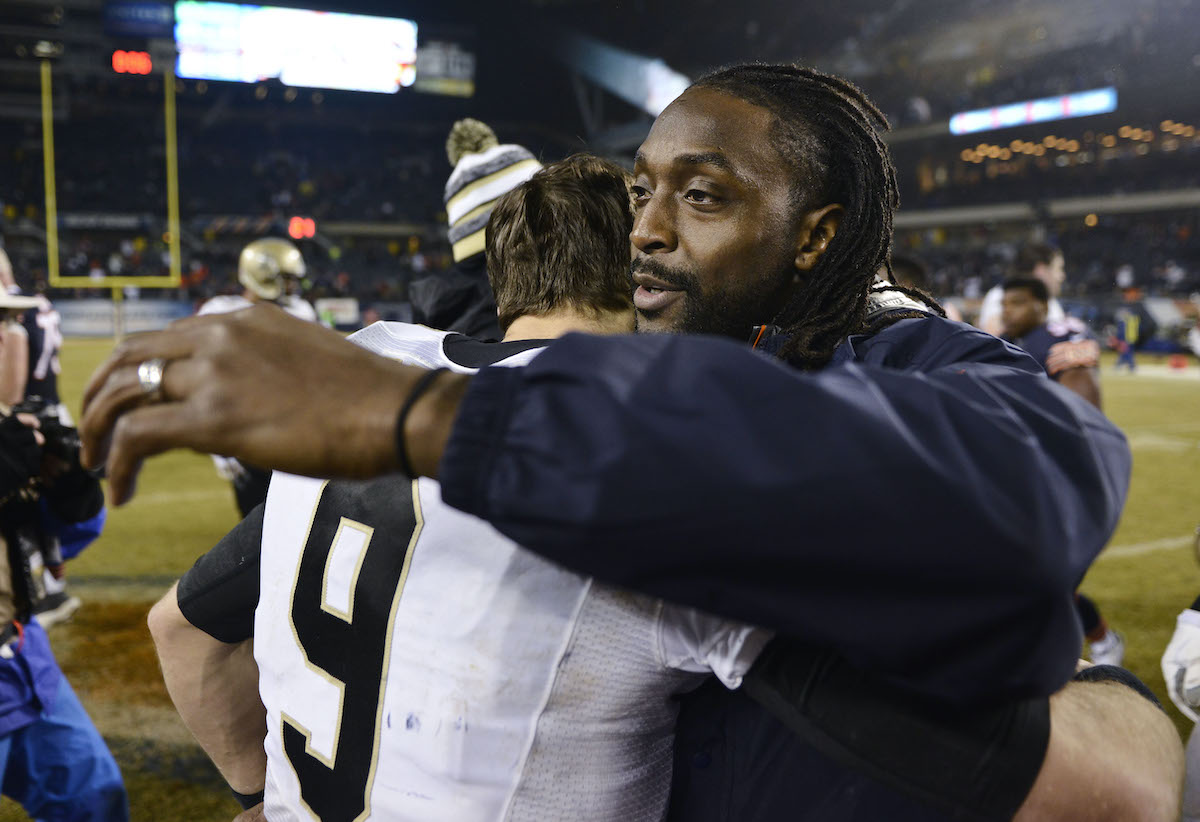 Charles Tillman of the Chicago Bears hugs Drew Brees of the New Orleans Saints after a 2014 game