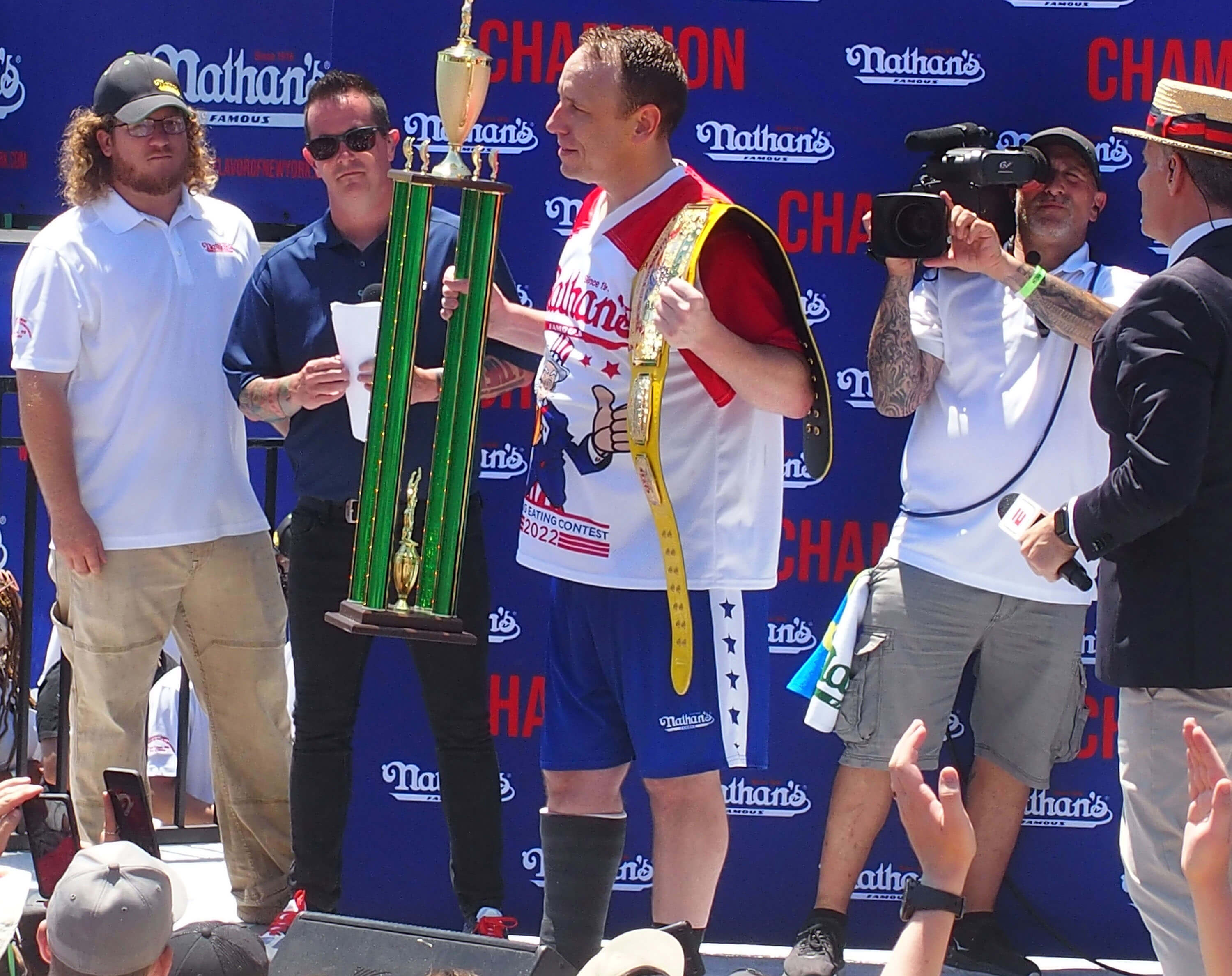Competitive eater Joey Chestnut wins with 63 hot dogs.