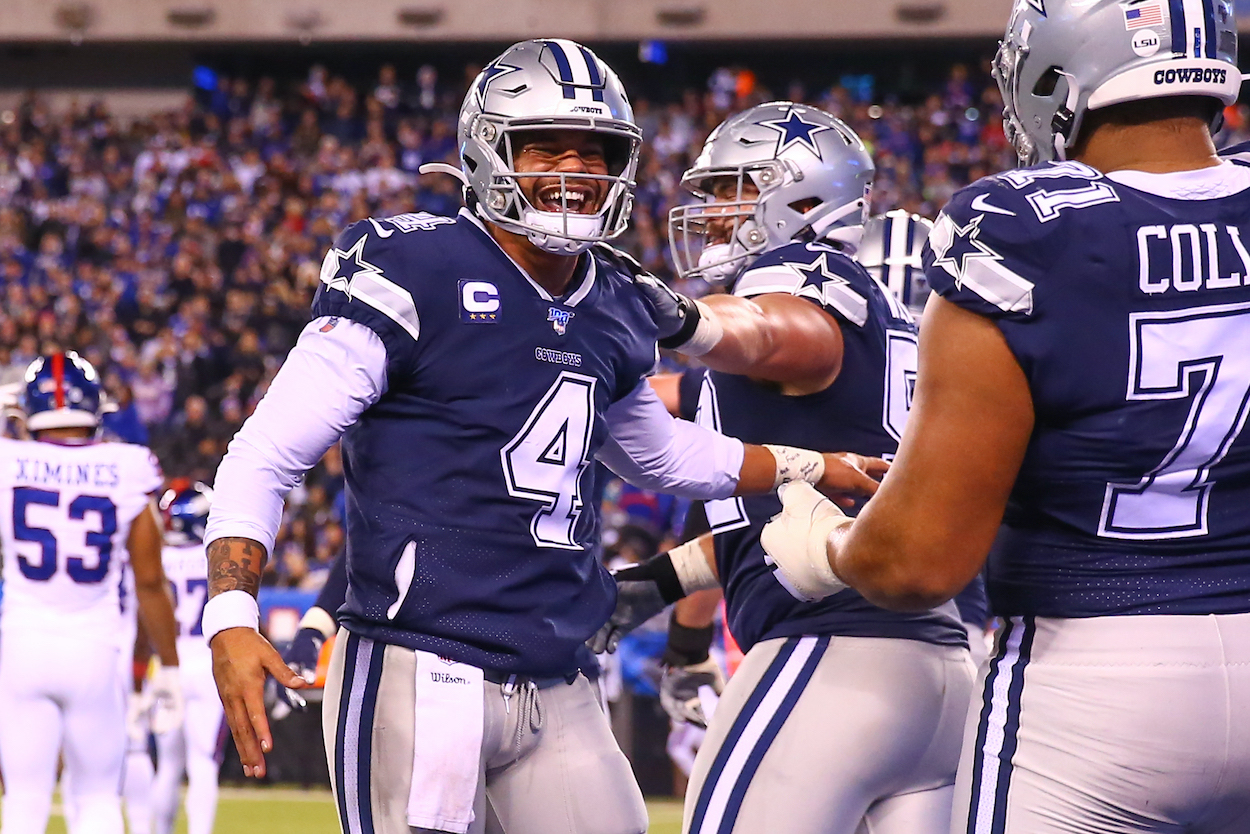 Dallas Cowboys quarterback Dak Prescott celebrates after a touchdown during the National Football League game between the New York Giants and the Dallas Cowboys on November 4, 2019 at MetLife Stadium in East Rutherford, NJ.