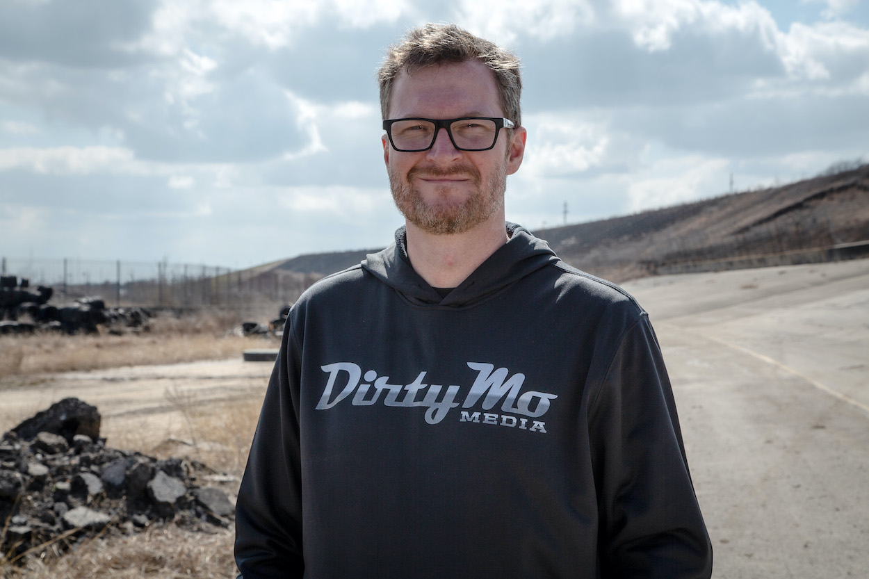 Dale Earnhardt Jr. poses in a black sweatshirt at the Texas Speedway