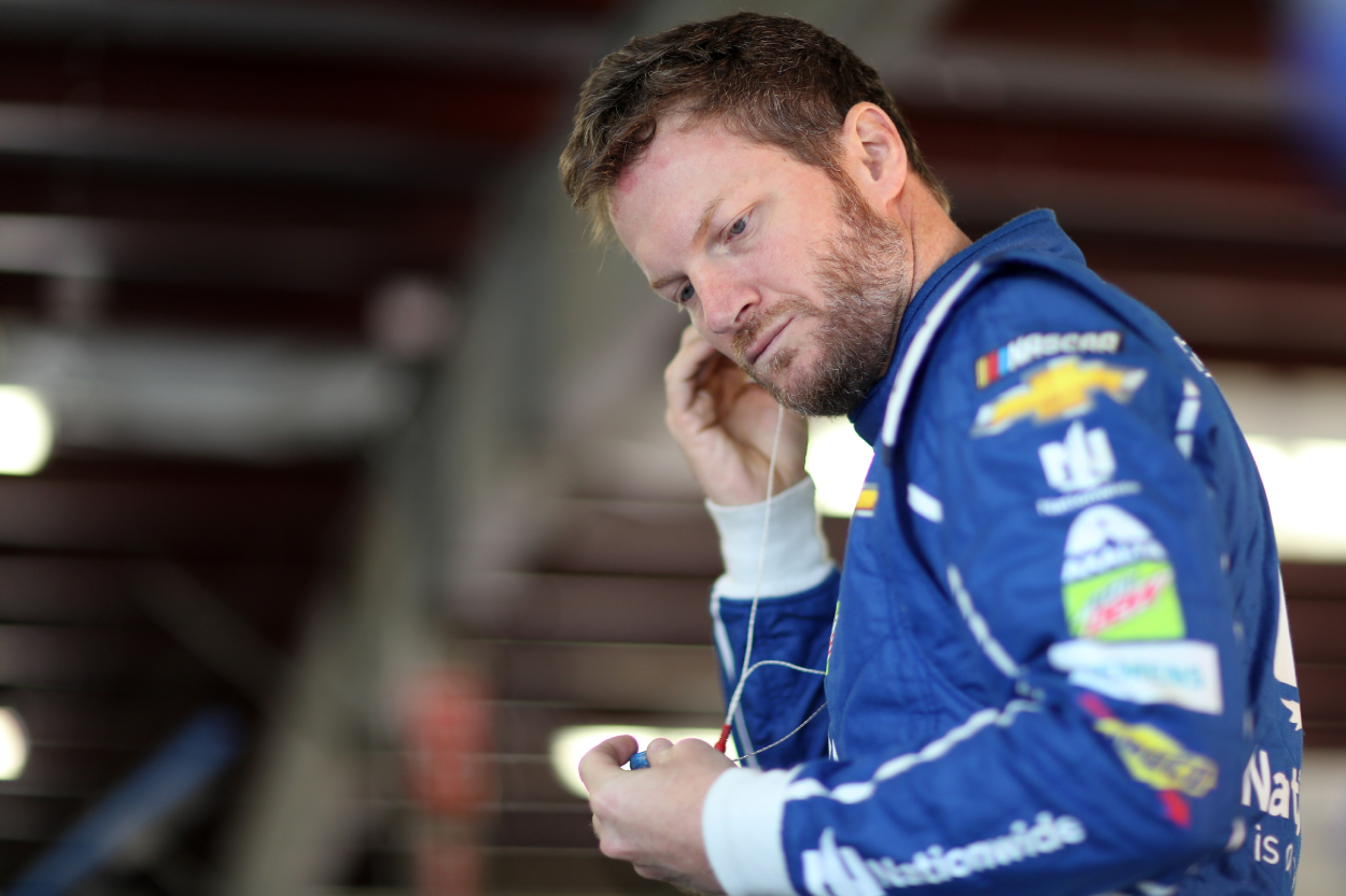 Dale Earnhardt Jr., driver of the #88 Nationwide Chevrolet, stands in the garage area during practice for the Monster Energy NASCAR Cup Series ISM Connect 300 in 2017.