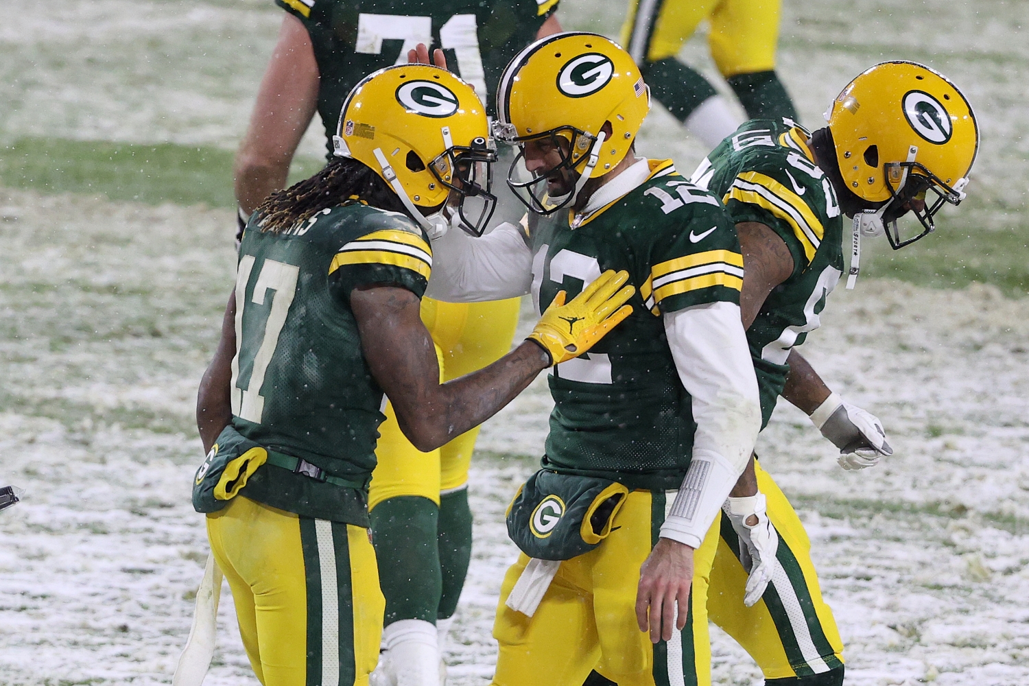 Green Bay Packers teammates Davante Adams and Aaron Rodgers celebrate scoring a touchdown.