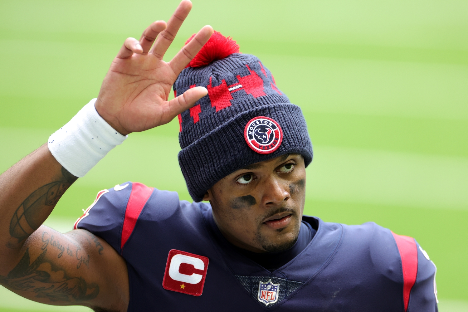 Houston Texans quarterback Deshaun Watson waves to the crowd after a game.