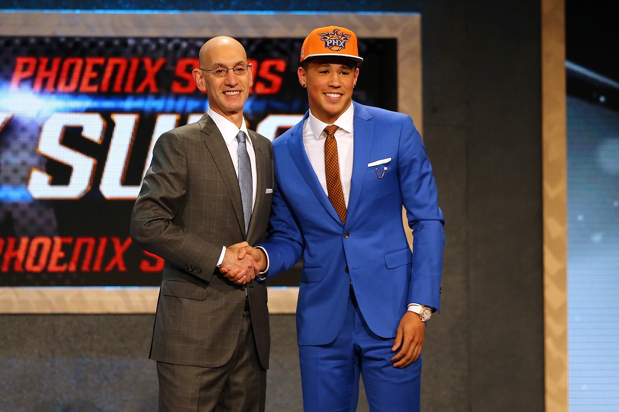 Adam Silver and Devin Booker onstage at the 2015 NBA draft