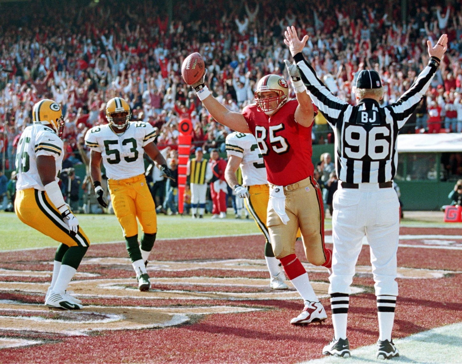 San Francisco 49ers tight end Greg Clark catches a touchdown pass against the Green Bay Packers.