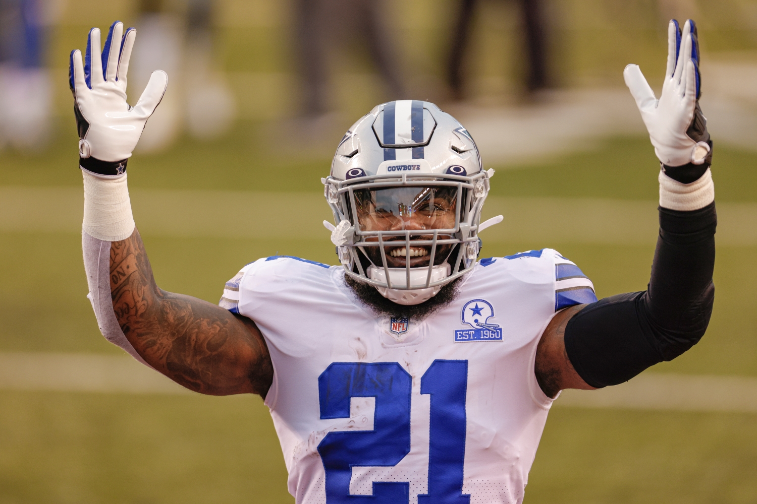 Dallas Cowboys running back Ezekiel Elliott acknowledges Ohio State fans before a game against the Cincinnati Bengals.