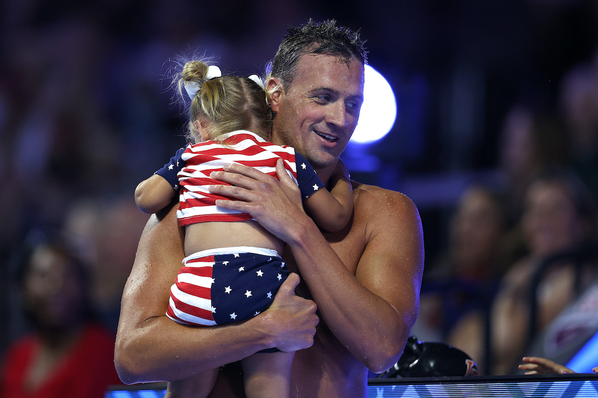Ryan Lochte holds daughter Liv Rae Lochte after competing in the Men's 200-meter during the 2021 U.S. Olympic Swimming Trials