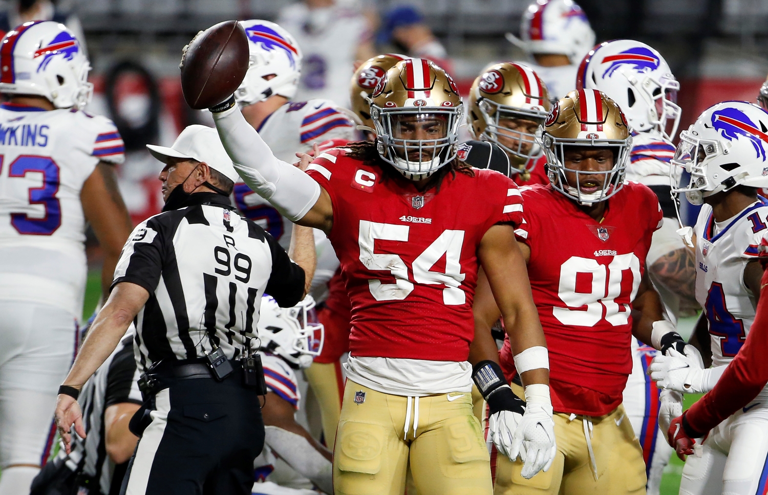 San Francisco 49ers linebacker Fred Warner celebrates recording a turnover against the Buffalo Bills.