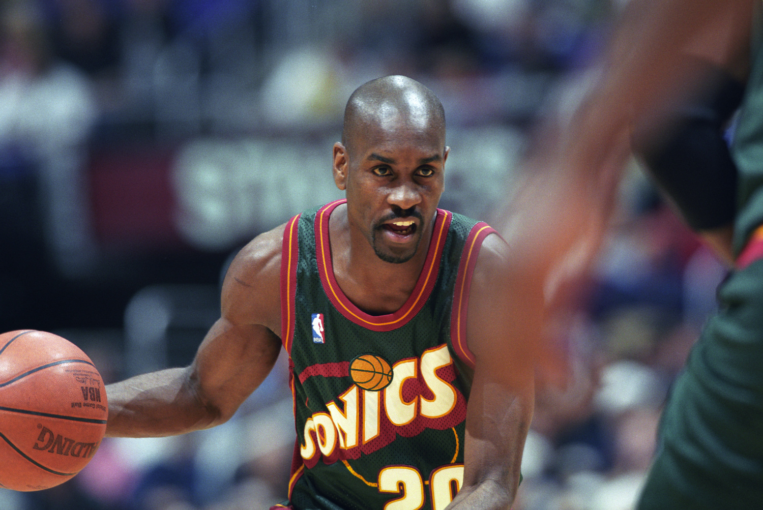 Gary Payton dribbles the ball up the floor for the Seattle SuperSonics.