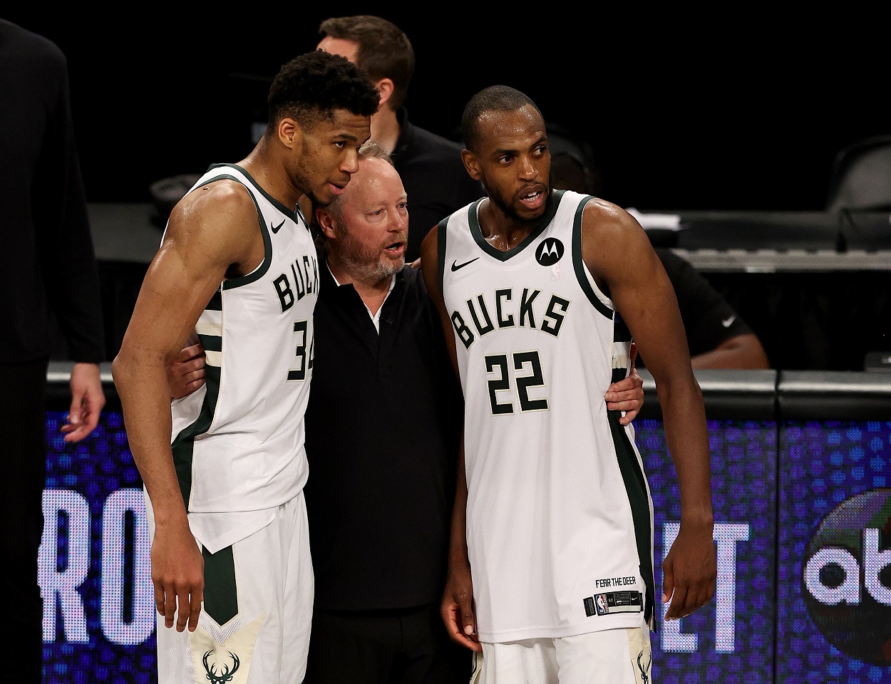 Giannis Antetokounmpo and Khris Middleton with Milwaukee Bucks head coach Mike Budenholzer following Game 7 of the second round of the 2021 NBA playoffs