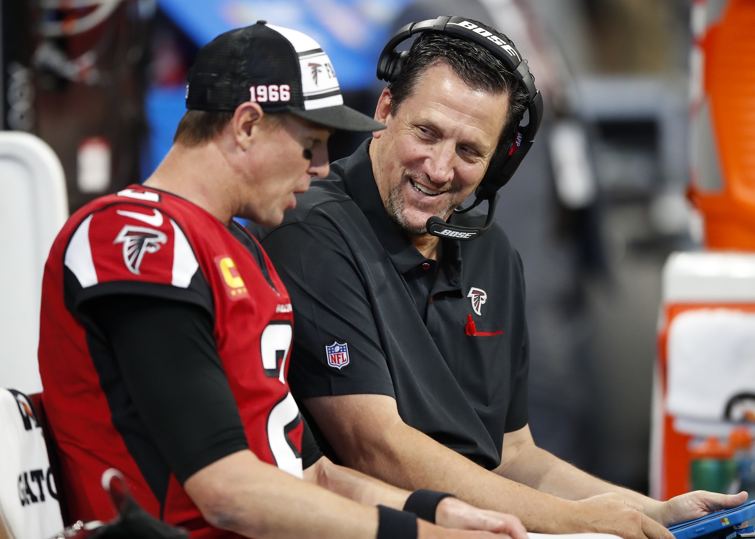 Quarterbacks coach Greg Knapp speaks with the Atlanta Falcons' Matt Ryan during the second half on an NFL game against the Carolina Panthers at Mercedes-Benz Stadium on Dec. 8, 2019. | Todd Kirkland/Getty Images