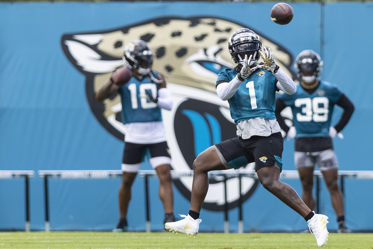 Travis Etienne of the Jacksonville Jaguars catches a pass during Jacksonville Jaguars Training Camp at TIAA Bank Field on June 08, 2021 in Jacksonville, Florida.