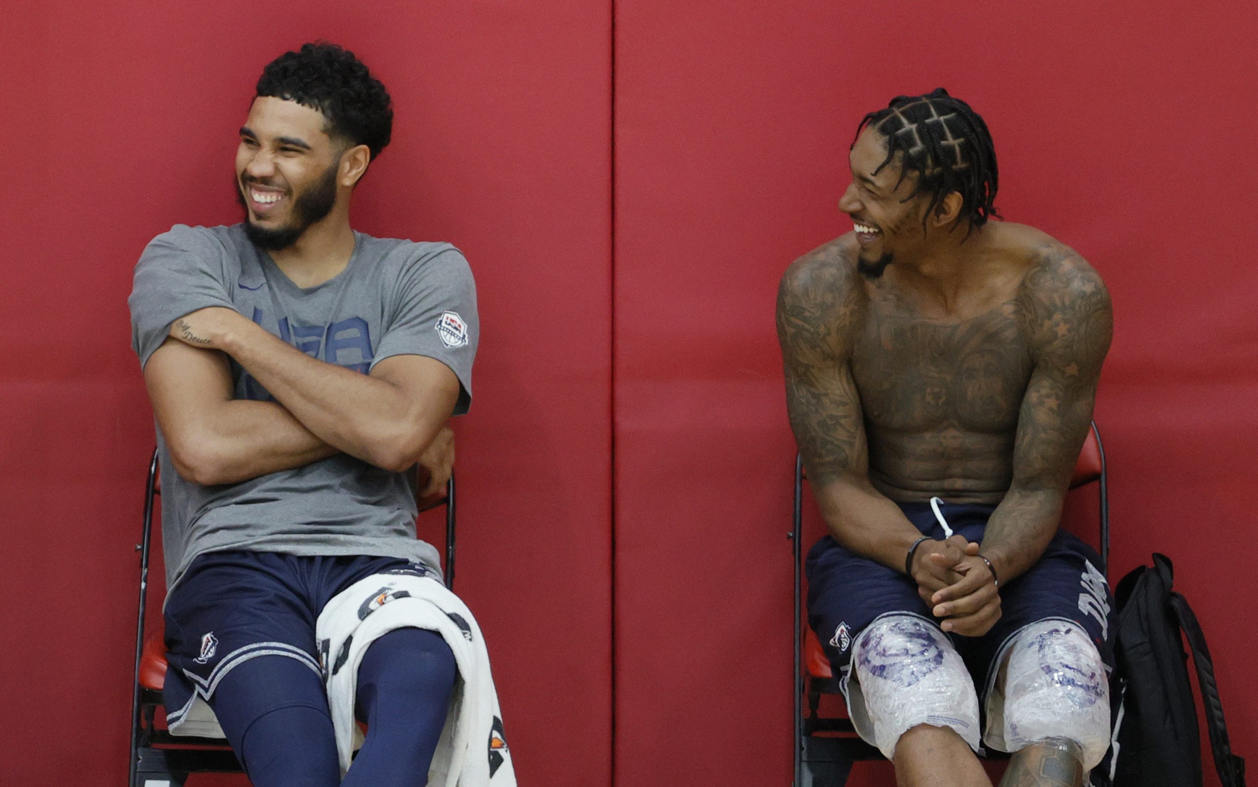 Jayson Tatum and Bradley Beal of the 2021 USA Basketball Men's National Team laugh after a practice.