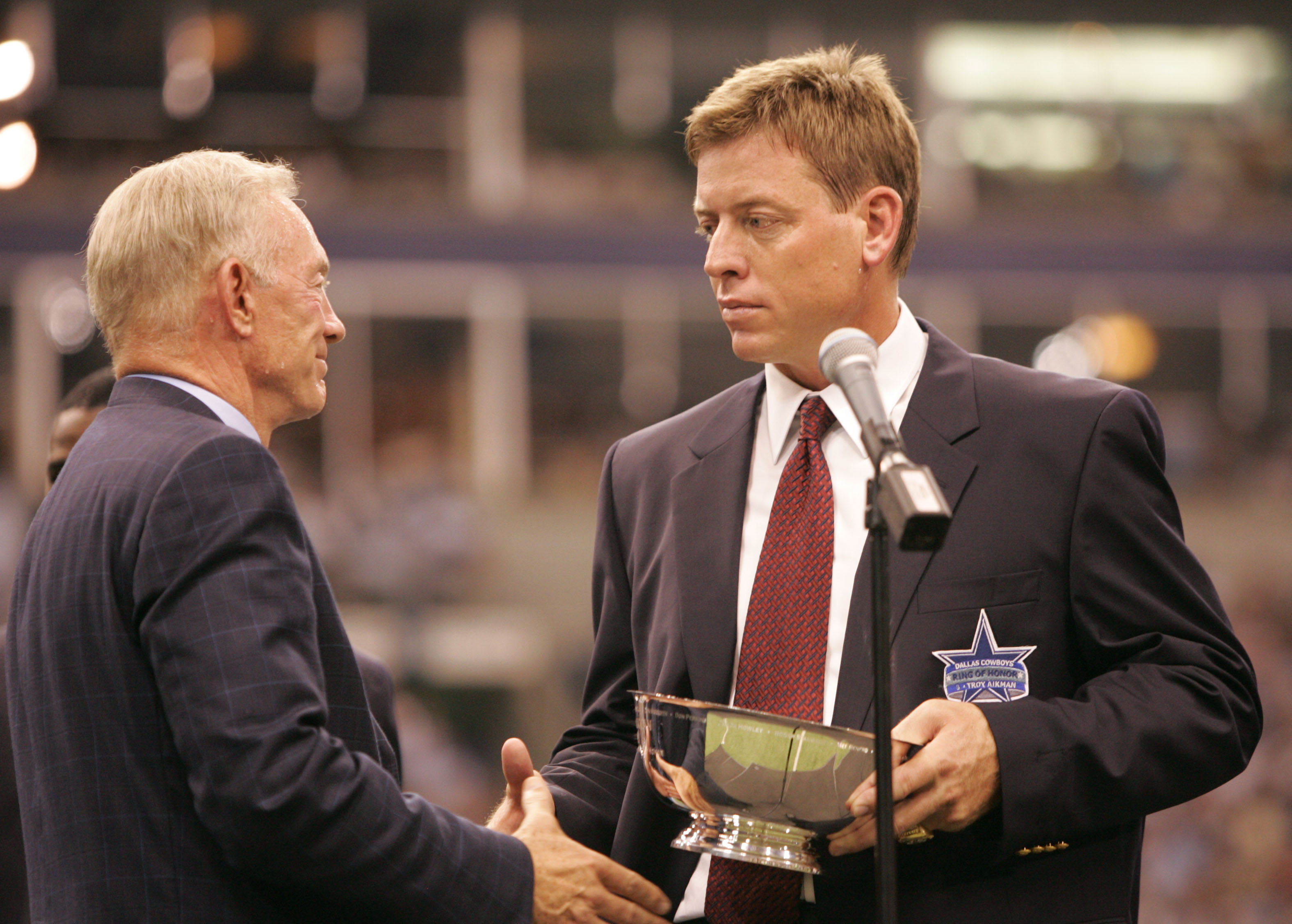 Dallas Cowboys owner Jerry Jones and former Dallas QB Troy Aikman during a 2005 ceremony in which Aikman was inducted into the Cowboys' Ring of Honor