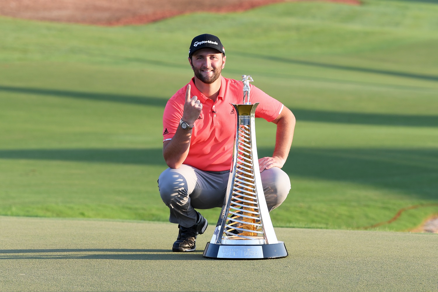 Jon Rahm of Spain poses with the Race to Dubai trophy following his victory in the DP World Tour Championship Dubai at Jumerirah Golf Estates on Nov. 24, 2019.