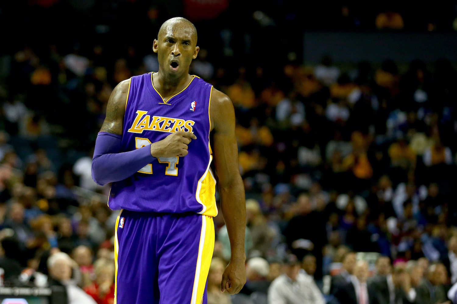 Kobe Bryant reacts on the court during the 2013-14 NBA season.