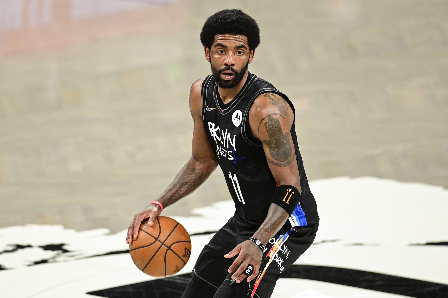 Kyrie Irving handles the ball against the Milwaukee Bucks in Game 2 of the NBA Eastern Conference semifinals at Barclays Center on June 7, 2021. | Steven Ryan/Getty Images