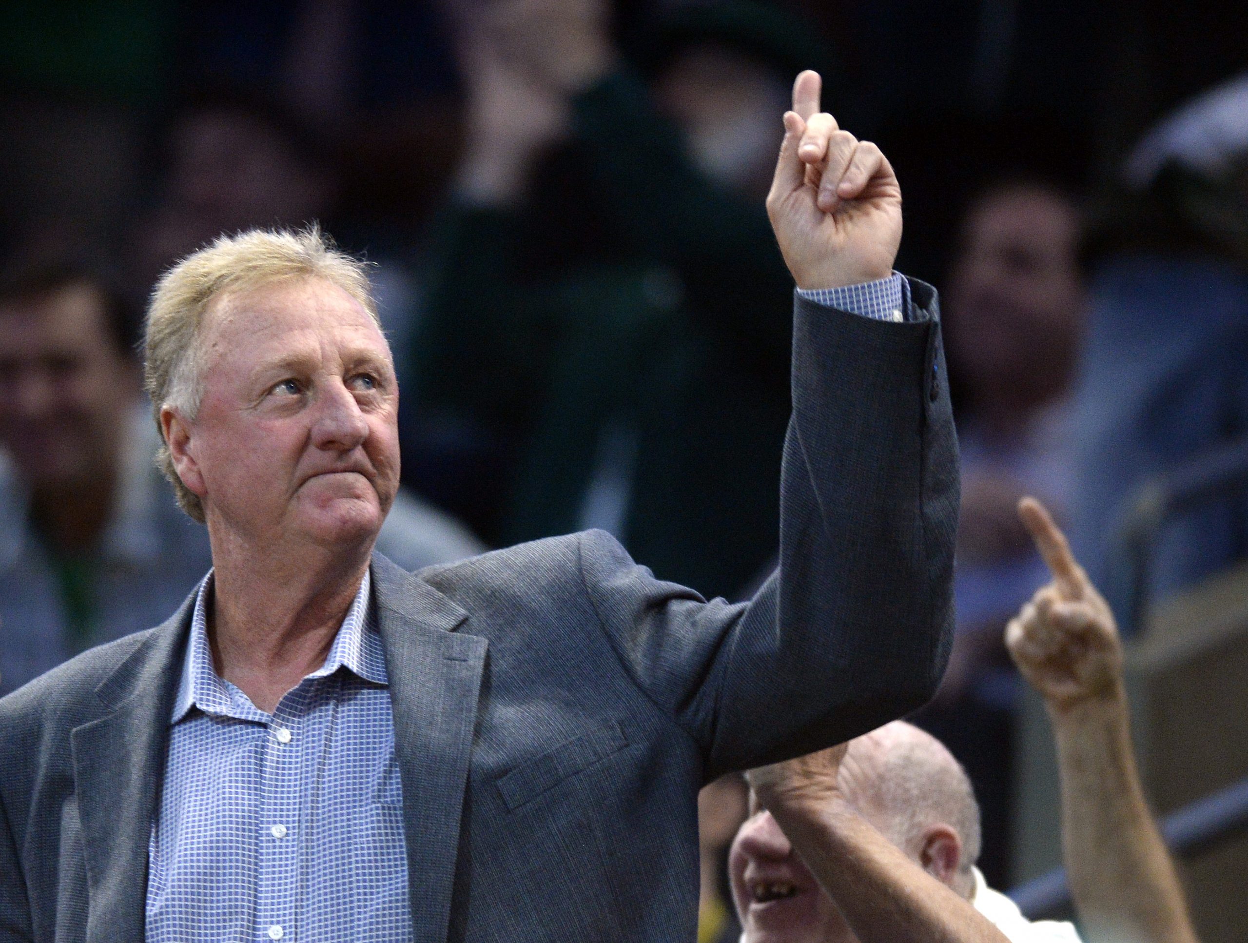Larry Bird waves to the crowd in Boston in 2019.
