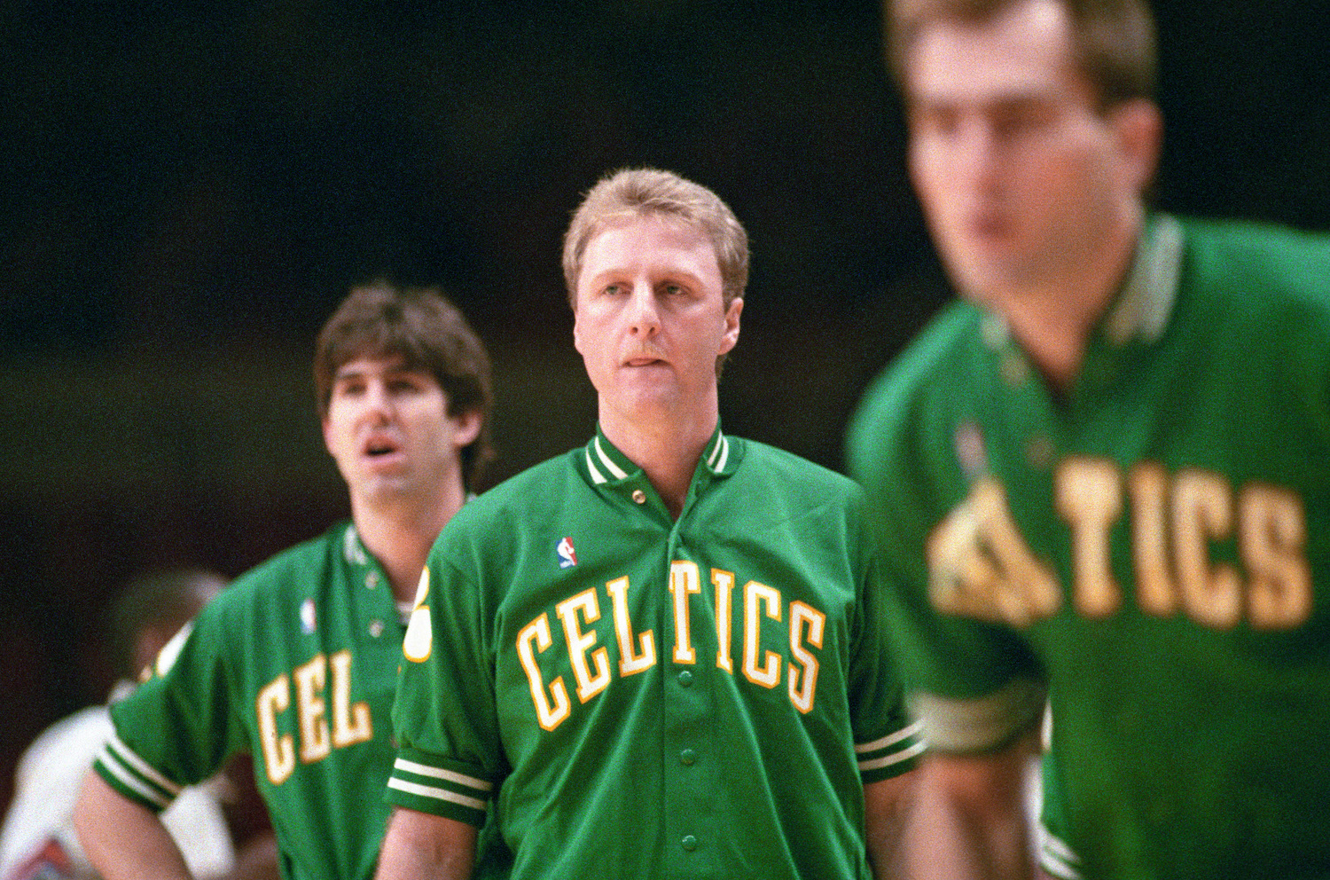 Larry Bird, who was battling back problems at that point of his career, warms up ahead of a 1988 Boston Celtics game.