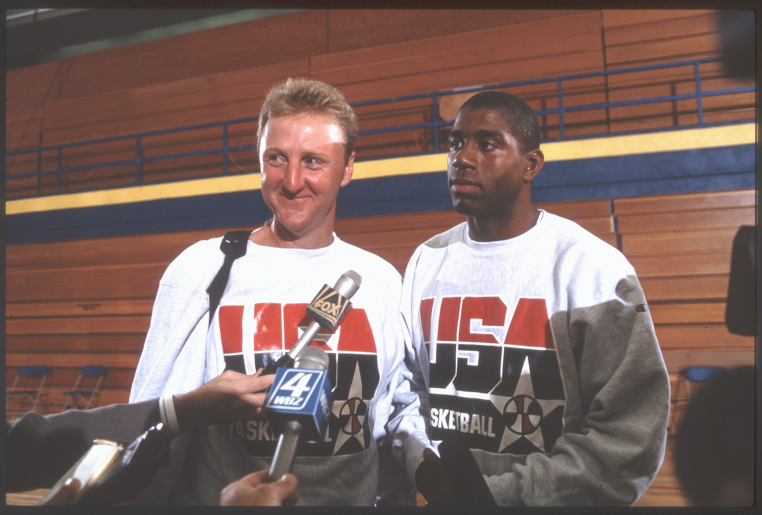 Dream Team co-captains Larry Bird (L) and Magic Johnson (R) meet with the media during the 1992 Olympics.