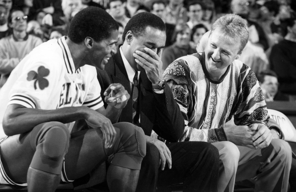 Boston Celtics Robert Parish, Dennis Johnson and Larry Bird share a laugh during a game against the Phoenix Suns in 1994.
