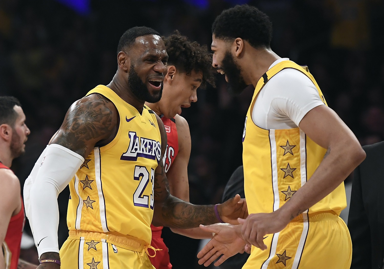 LeBron James of the Los Angeles Lakers reacts after Anthony Davis dunked against his former team, the New Orleans Pelicans, at Staples Center on Jan. 3, 2020.